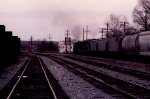 s getting dark as a northbound train heads for the signals at the north end of the yard